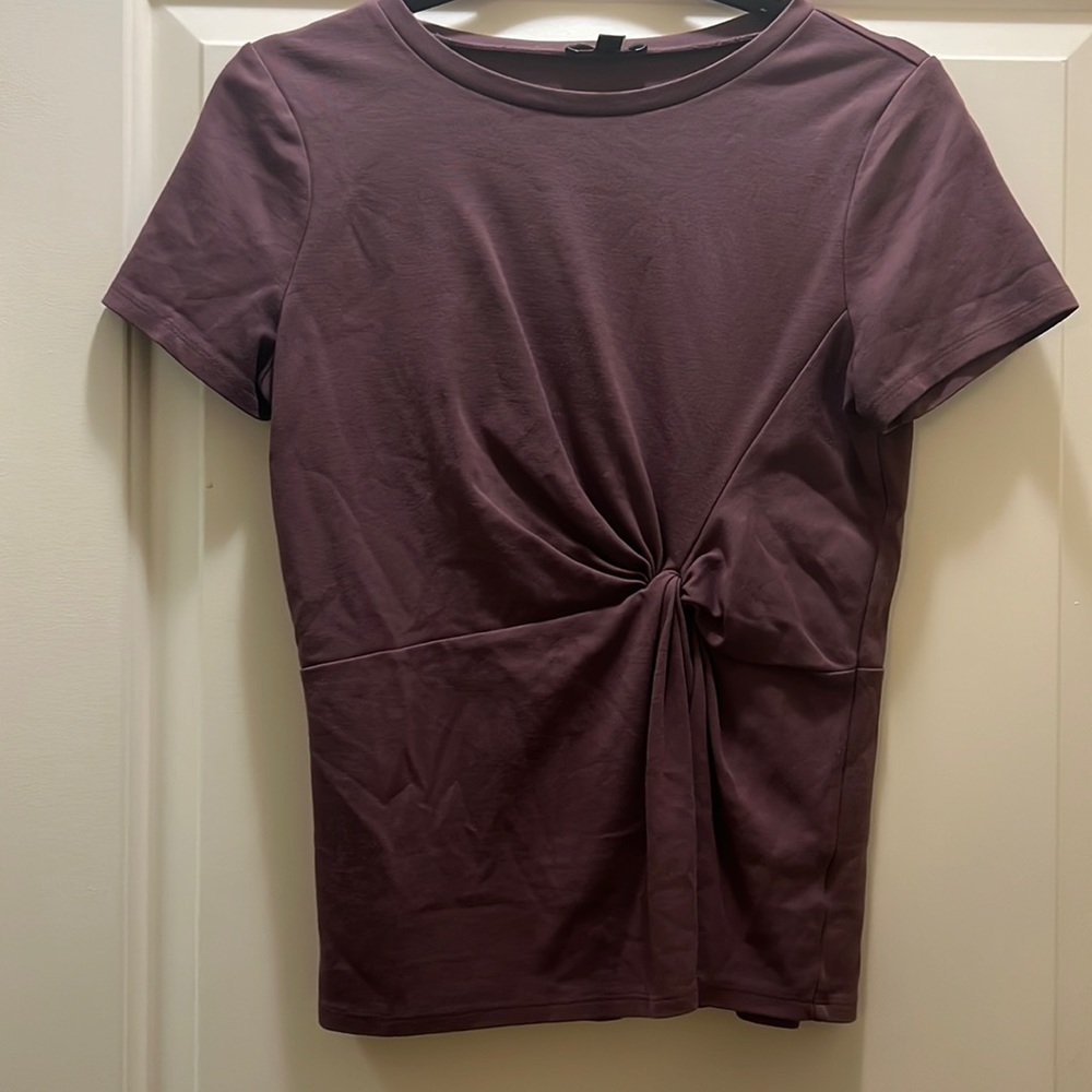 Express short sleeve purple top. With crunch design on the front of the top.